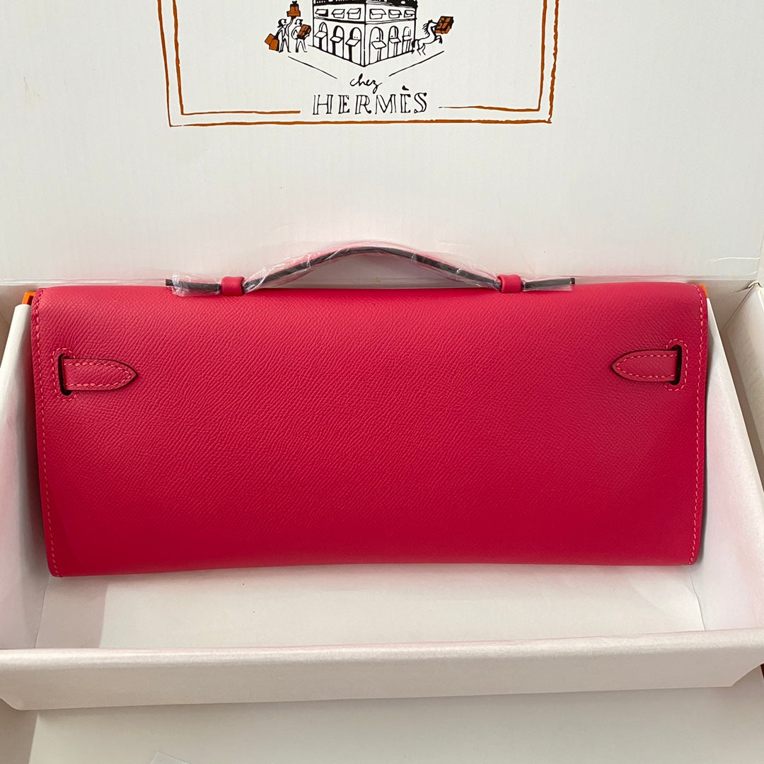 HERMES KELLY CUT 31 IN CHERRY RED CALFSKIN WITH SILVER HARDWARE