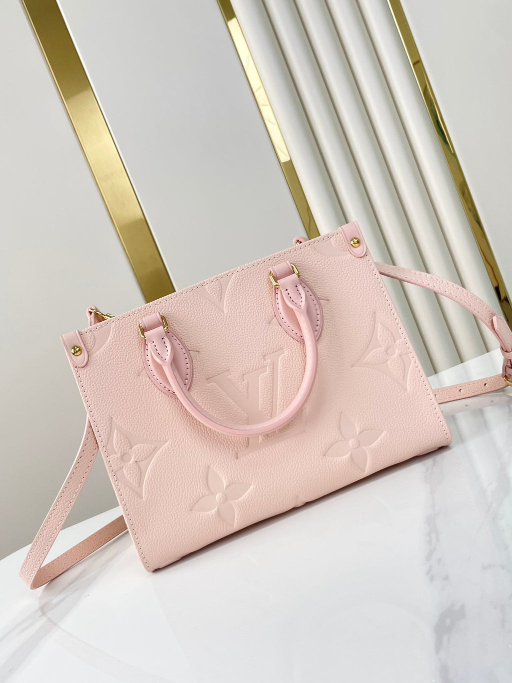 LOUIS VUITTON ONTHEGO PM 25 IN OPALE PINK MONOGRAM EMPREINTE LEATHER