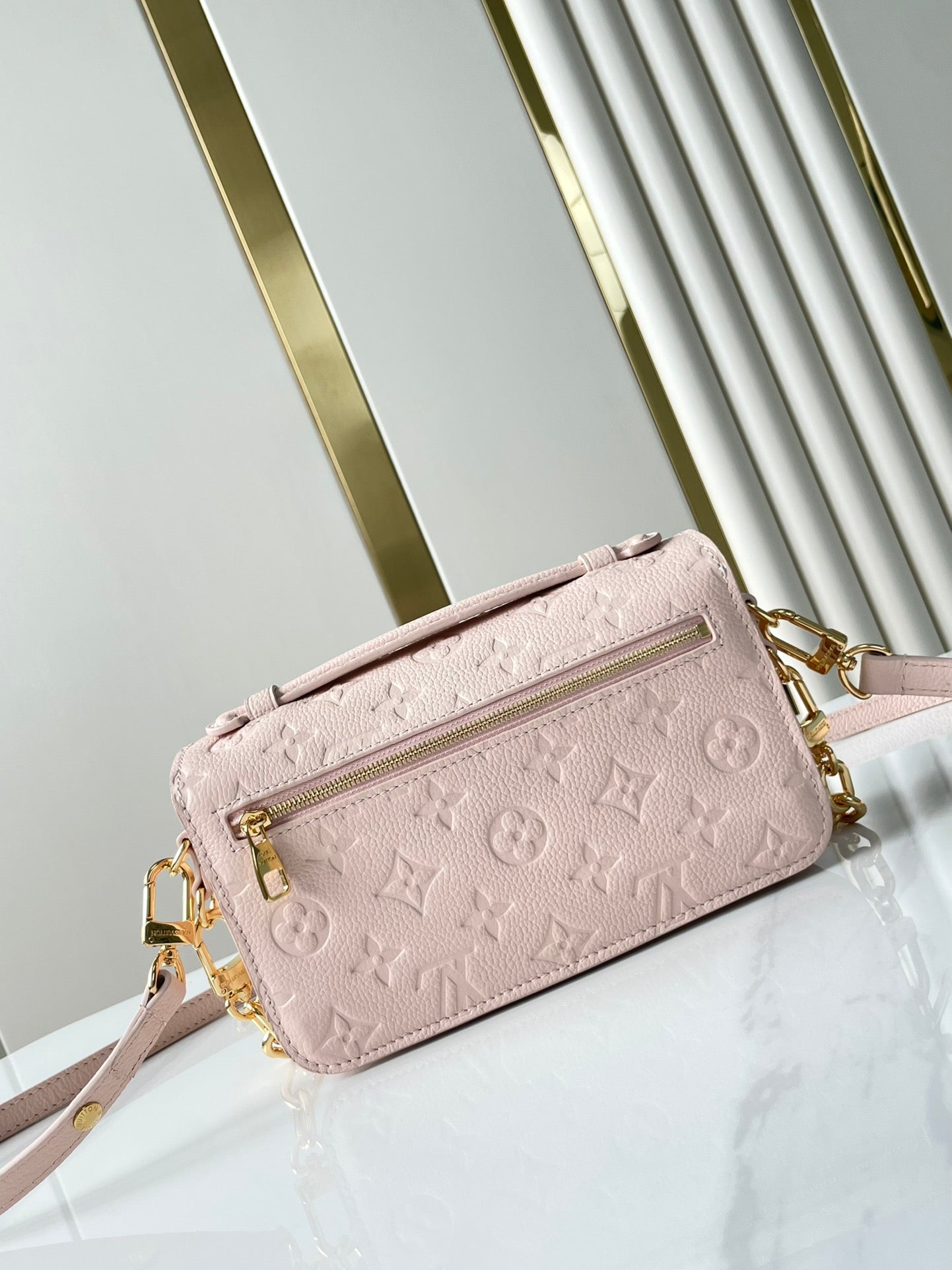 LOUIS VUITTON POCHETTE MÉTIS EAST WEST 21 IN PINK OPALE MONOGRAM ECLIPSE CANVAS GOLD BUCKLE