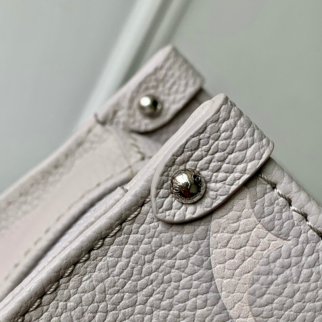 LOUIS VUITTON ONTHEGO EAST WEST BAG 25 IN BICOLOR MONOGRAM EMPREINTE LEATHER