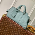 LOUIS VUITTON KEEPALL BANDOULIÈRE 25 BAG IN MISTY LAKE GREEN MONOGRAM TAURILLON CALFSKIN