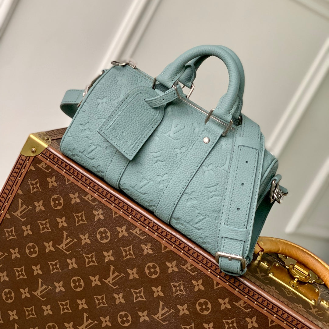 LOUIS VUITTON KEEPALL BANDOULIÈRE 25 BAG IN MISTY LAKE GREEN MONOGRAM TAURILLON CALFSKIN
