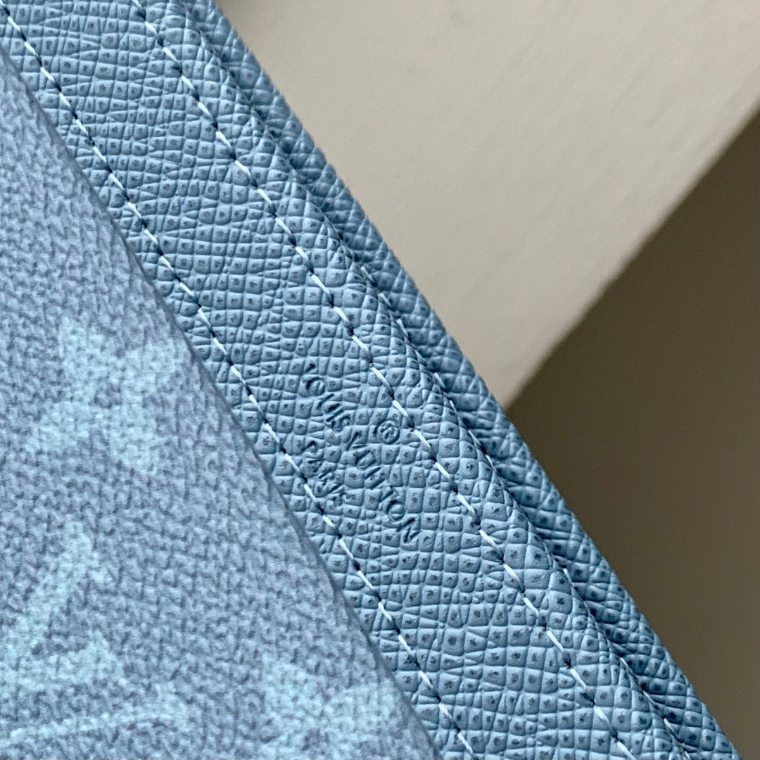 LOUIS VUITTON GASTON WEARABLE WALLET 22 IN BLUE MONOGRAM COATED CANVAS