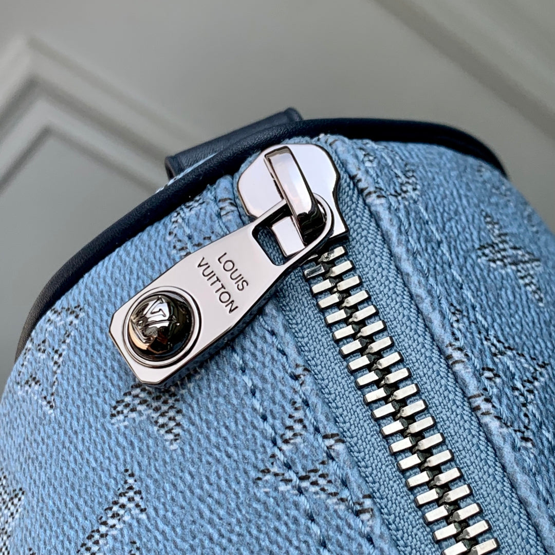 LOUIS VUITTON KEEPALL BANDOULIÈRE 25 INSKY BLUE MONOGRAM HERITAGE CANVAS DARK BLUE CALFSKIN