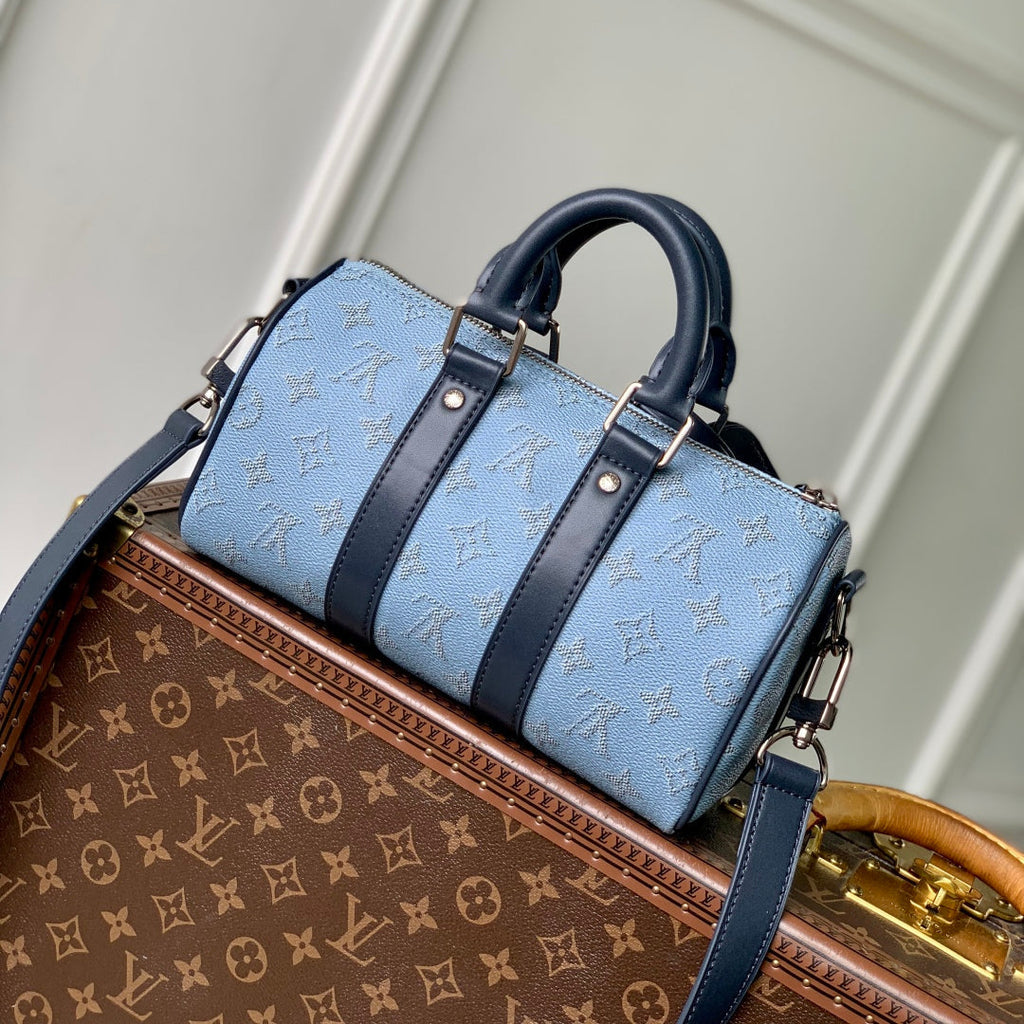 LOUIS VUITTON KEEPALL BANDOULIÈRE 25 INSKY BLUE MONOGRAM HERITAGE CANVAS DARK BLUE CALFSKIN