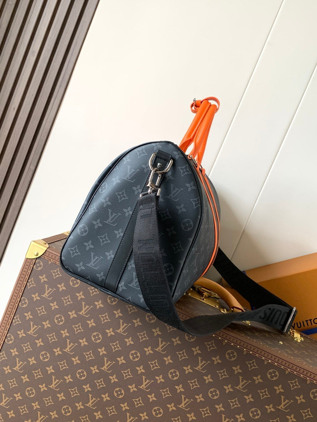 LOUIS VUITTON LV 25S KEEPALL 45 WITH SHOULDER STRAP IN BLACK ORANGE COATED MONOGRAM ECLIPSE CANVAS AND CALFSKIN