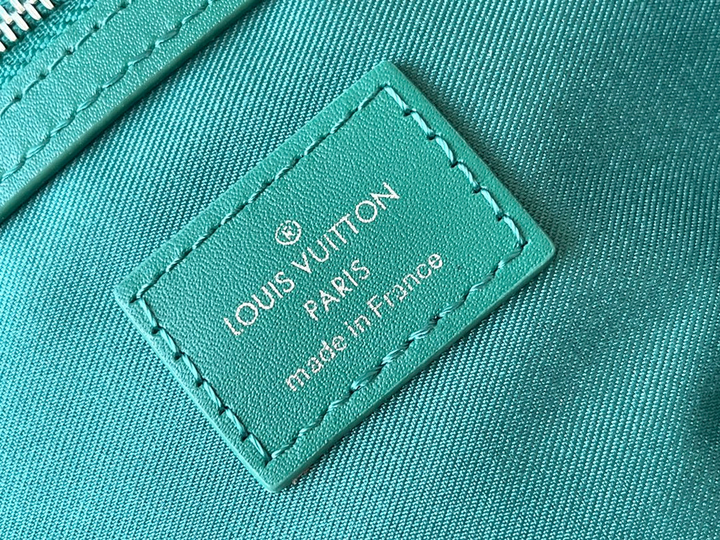 LOUIS VUITTON KEEPALL BANDOULIÈRE 50 IN GREEN MONOGRAM HERITAGE CANVAS