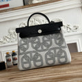 HERMES HERBAG ZIP 31 LAQUERED BAG IN OFF-WHITE MIX BLACK H PLUME CANVAS