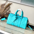LOUIS VUITTON KEEPALL BANDOULIÈRE 25 IN TURQUOISE BLUE MONOGRAM EMBOSSED CALFSKIN