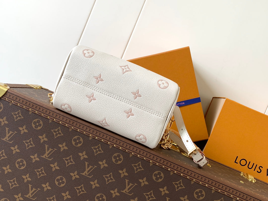 LOUIS VUITTON SPEEDY BANDOULIÈRE 21 IN WHITE AND PINK MONOGRAM CANVAS